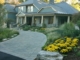 Stone Driveway with Perennial Foundation Plantings and Ornamental grasses